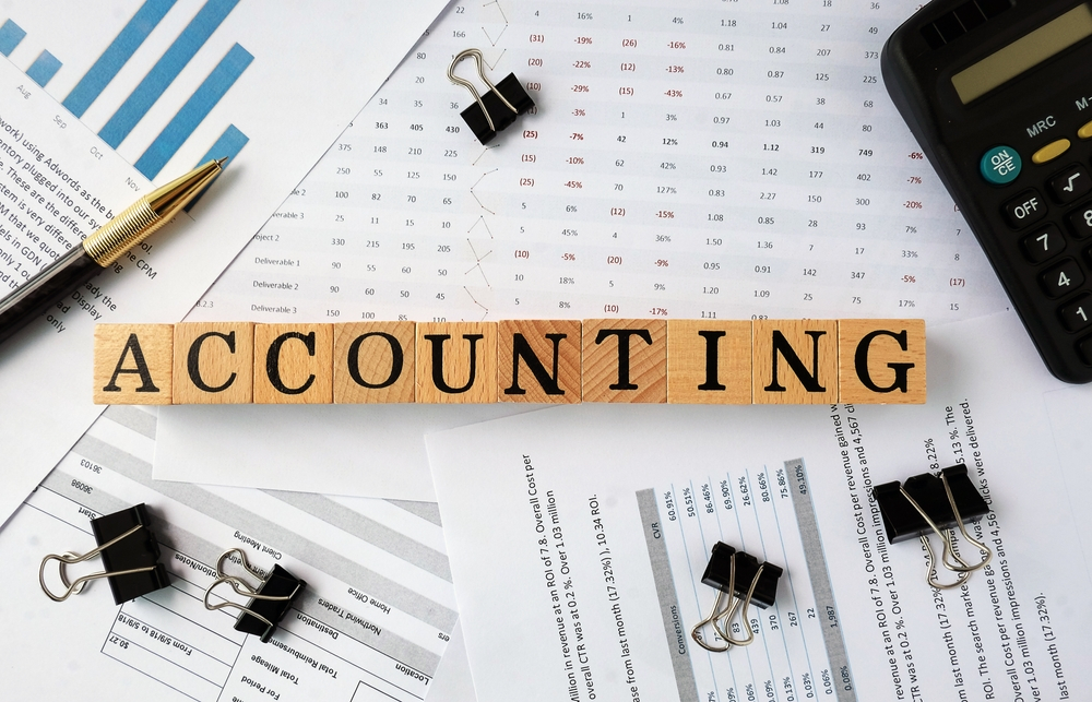FedhaTrac accountant reconciling accounts and preparing financial reports for a Kenyan business